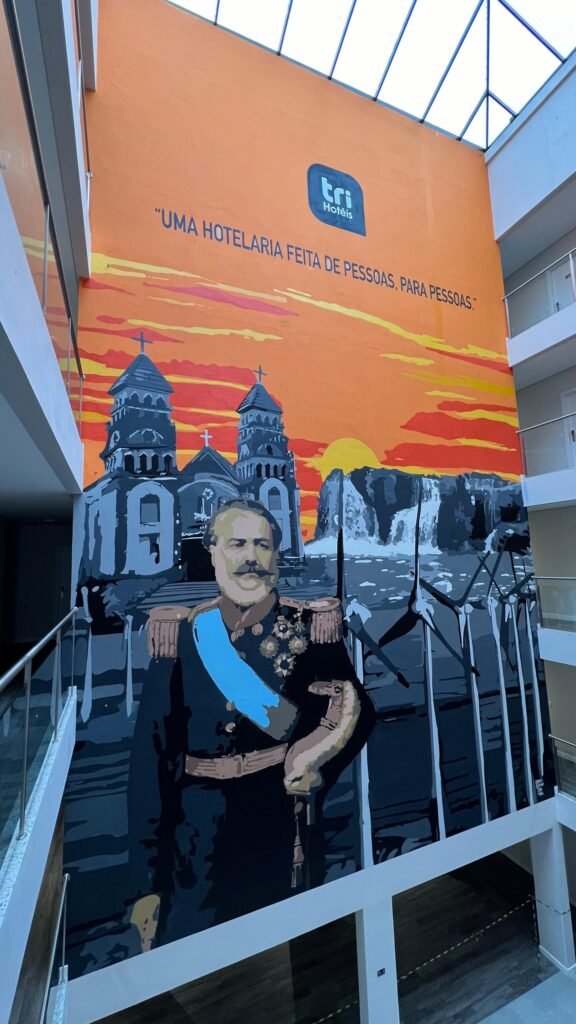 Retrato do General Osório diante da igreja de duas torres e da cascata